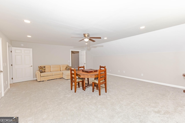 dining area with recessed lighting, lofted ceiling, light colored carpet, a ceiling fan, and baseboards