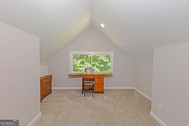 office with baseboards, vaulted ceiling, and carpet flooring