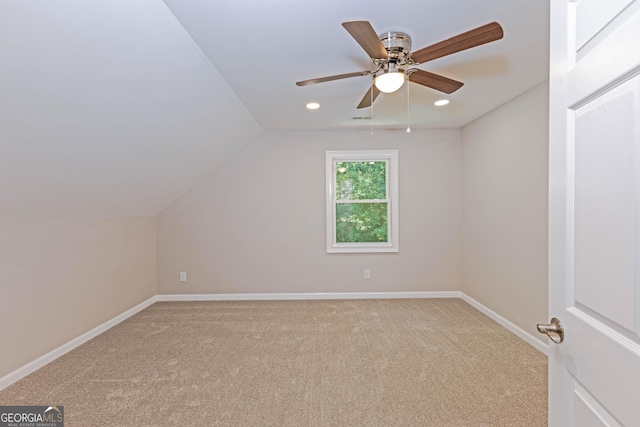 additional living space with lofted ceiling, ceiling fan, recessed lighting, carpet flooring, and baseboards