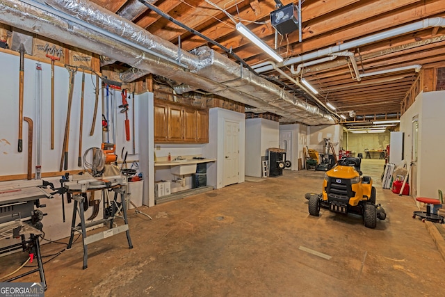 unfinished basement featuring a workshop area