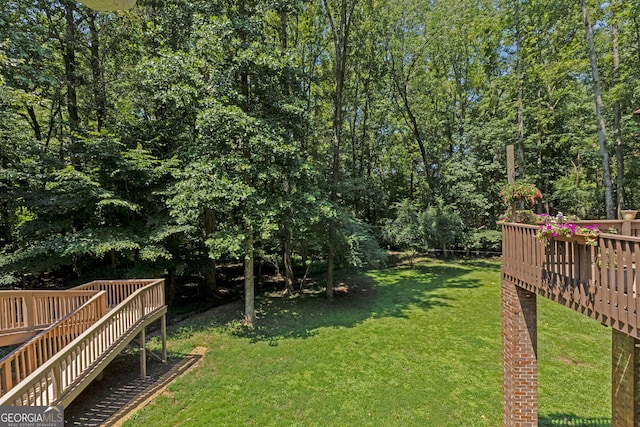 view of yard with a wooden deck