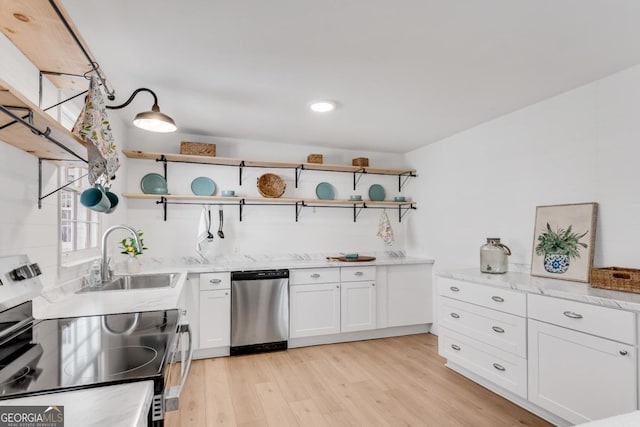 kitchen with light wood-style flooring, white cabinetry, stainless steel appliances, and open shelves