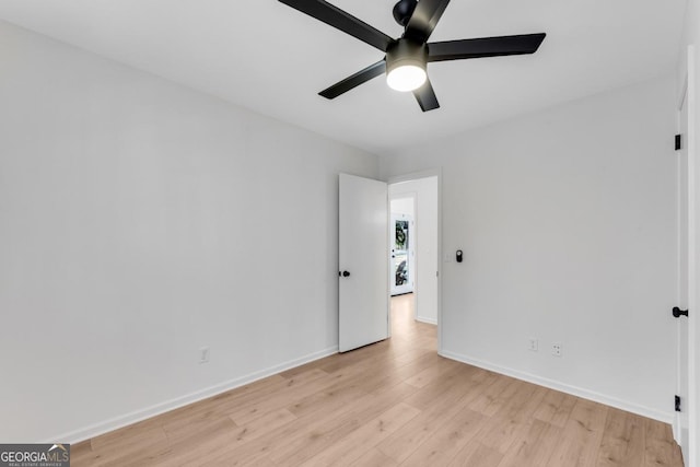 unfurnished bedroom with light wood-style flooring, baseboards, and a ceiling fan