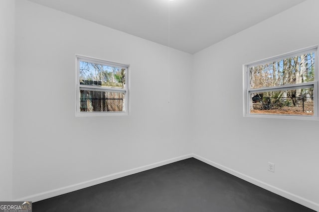 empty room with baseboards