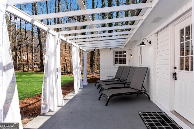 view of patio featuring a pergola