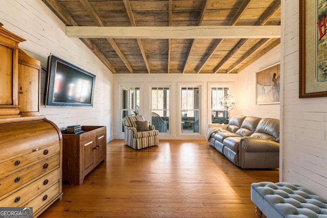 living area featuring vaulted ceiling with beams, wood ceiling, and wood-type flooring