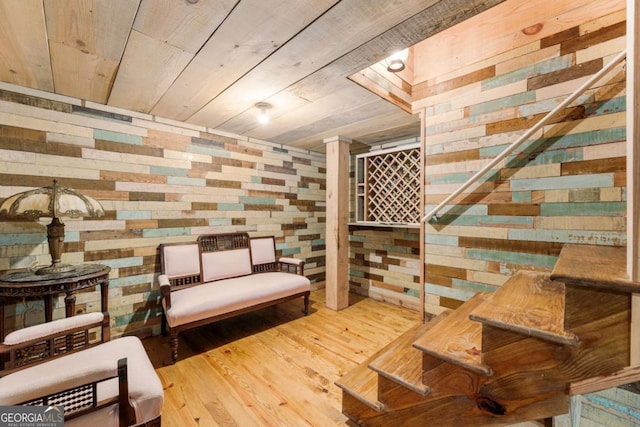 wine room with wooden ceiling, wood finished floors, and wood walls