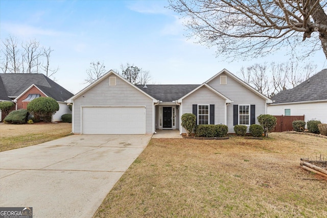 ranch-style home with concrete driveway, a front lawn, an attached garage, and fence