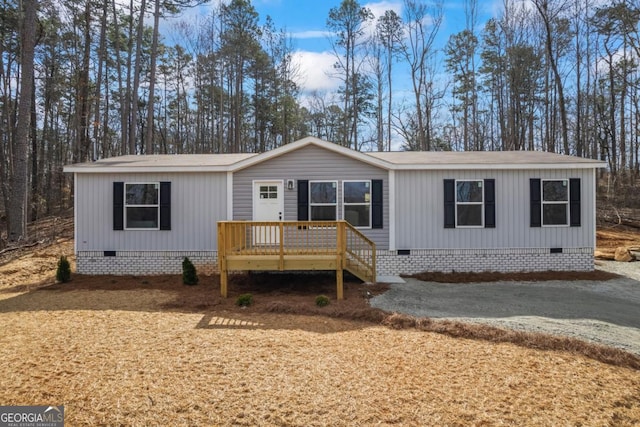 manufactured / mobile home with crawl space and a deck