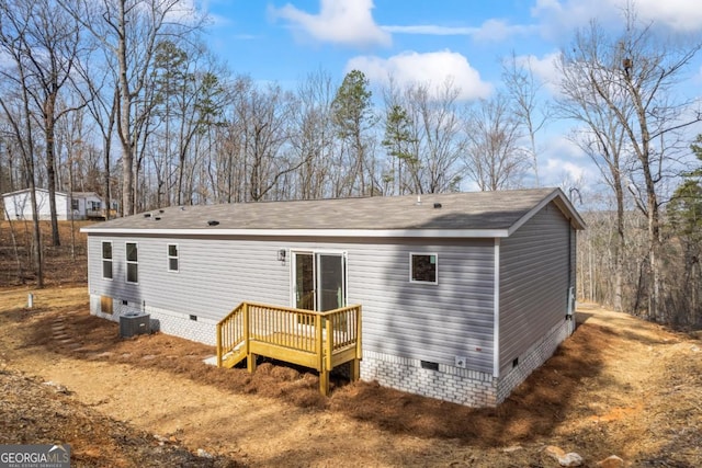 back of property featuring crawl space, a wooden deck, and central air condition unit