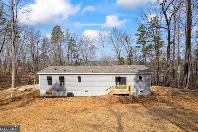 rear view of house featuring crawl space