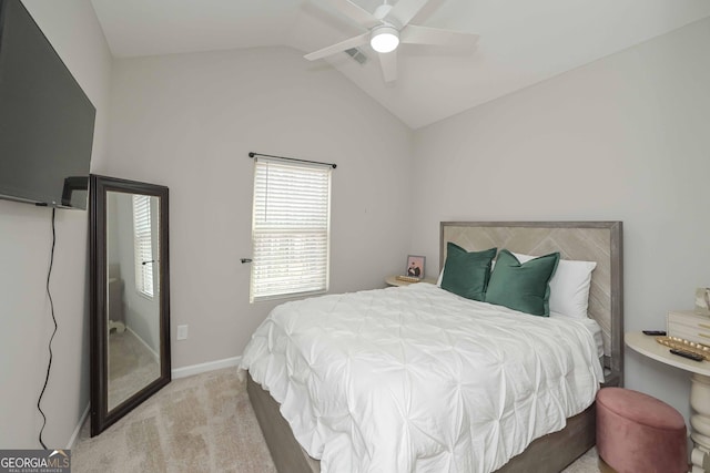 bedroom with ceiling fan, carpet, baseboards, and vaulted ceiling