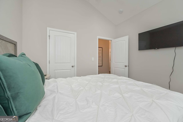 bedroom featuring vaulted ceiling