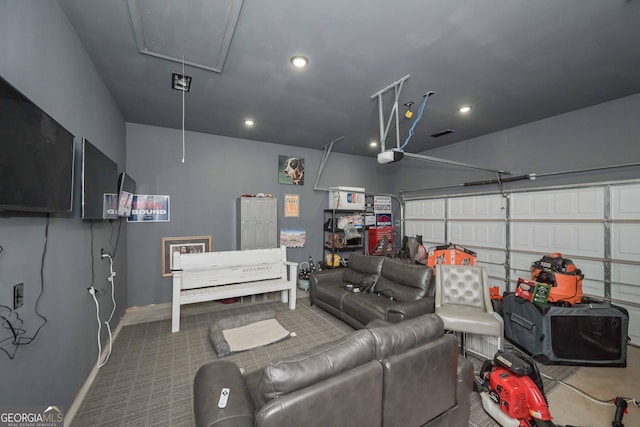 garage featuring recessed lighting and baseboards