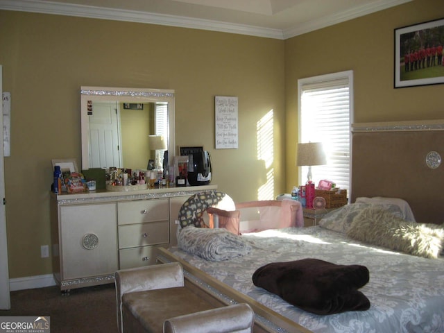 carpeted bedroom featuring ornamental molding and baseboards