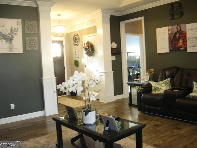 living room featuring ornamental molding, dark wood-style flooring, decorative columns, and baseboards