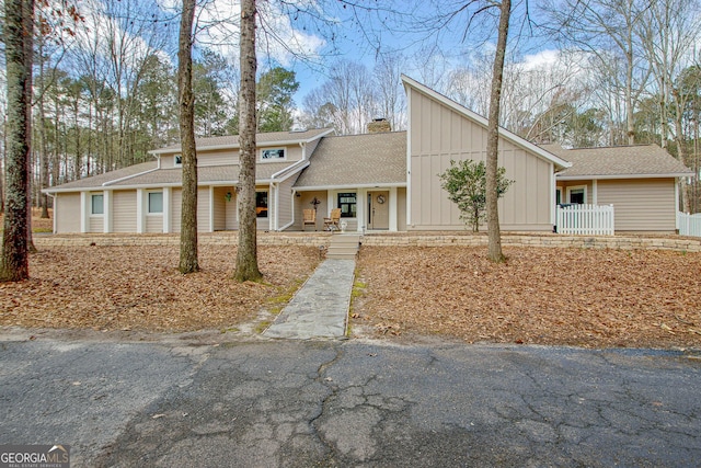 mid-century home featuring a chimney