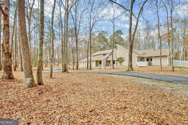 view of front of house featuring fence and board and batten siding