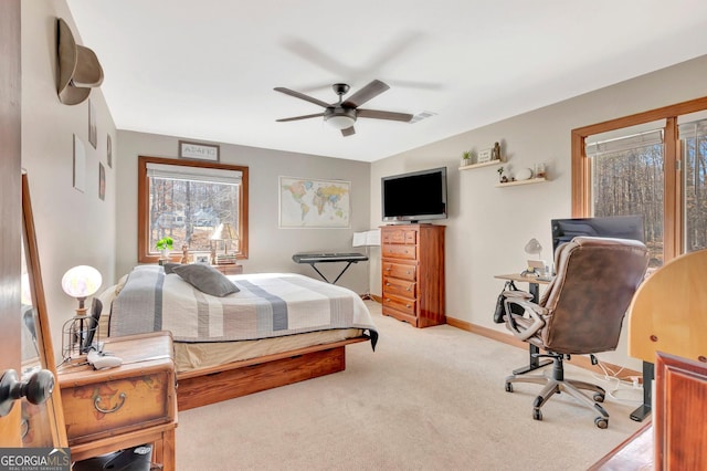 bedroom featuring ceiling fan, carpet floors, visible vents, and baseboards