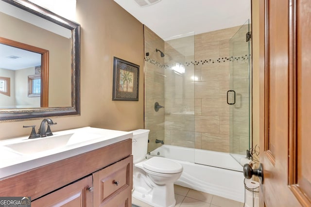 full bath with visible vents, toilet, enclosed tub / shower combo, tile patterned flooring, and vanity