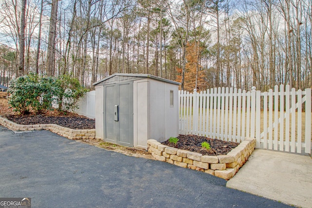 view of shed with a fenced backyard