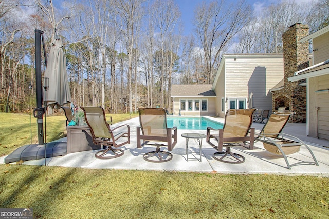 view of patio with french doors and an outdoor pool