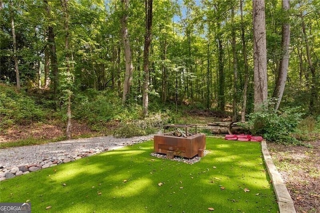 view of yard with a wooded view