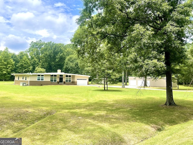 view of yard with a garage