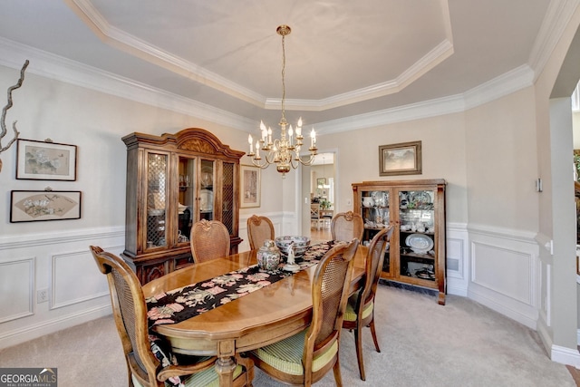 1301 Dayspring Trce, Lawrenceville, GA 30045 - dining area featuring light carpet, a decorative wall, a raised ceiling, and a notable chandelier
