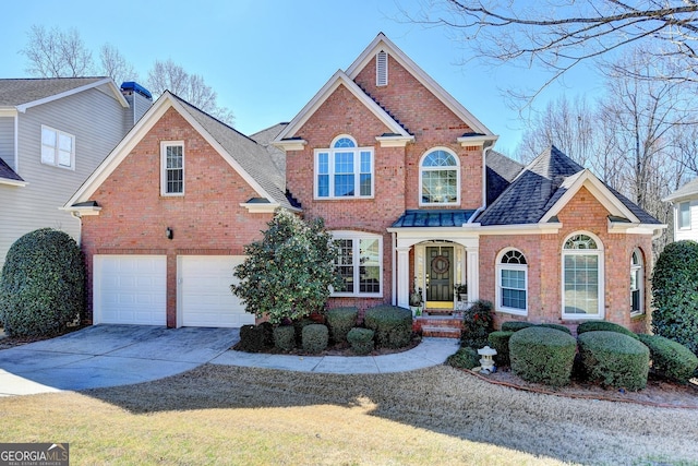 view of front of property featuring a garage, roof with shingles, concrete driveway, and brick siding