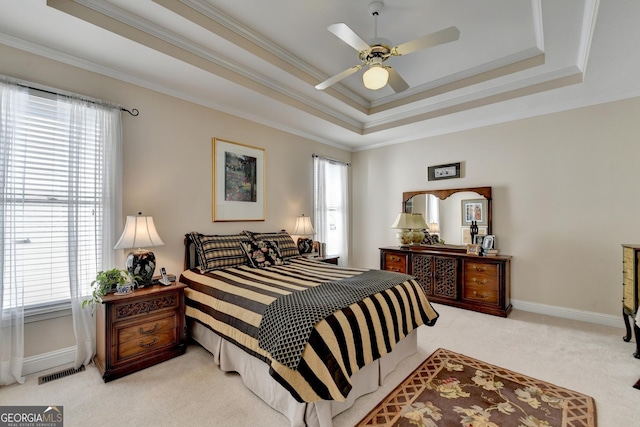 1301 Dayspring Trce, Lawrenceville, GA 30045 - carpeted bedroom featuring ornamental molding, a tray ceiling, visible vents, and baseboards
