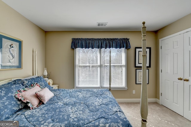 1301 Dayspring Trce, Lawrenceville, GA 30045 - bedroom with carpet floors, baseboards, visible vents, and a closet