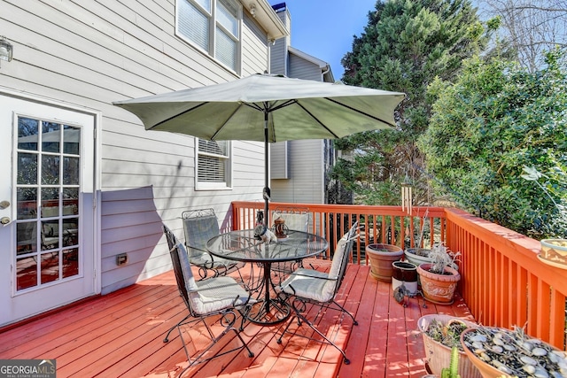 1301 Dayspring Trce, Lawrenceville, GA 30045 - wooden terrace with outdoor dining area