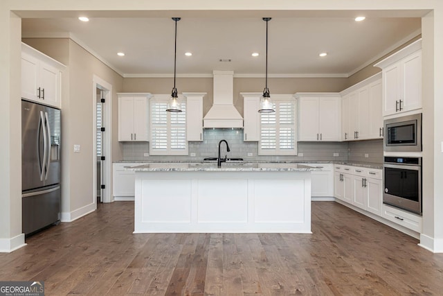 kitchen with ornamental molding, stainless steel appliances, premium range hood, and dark wood finished floors