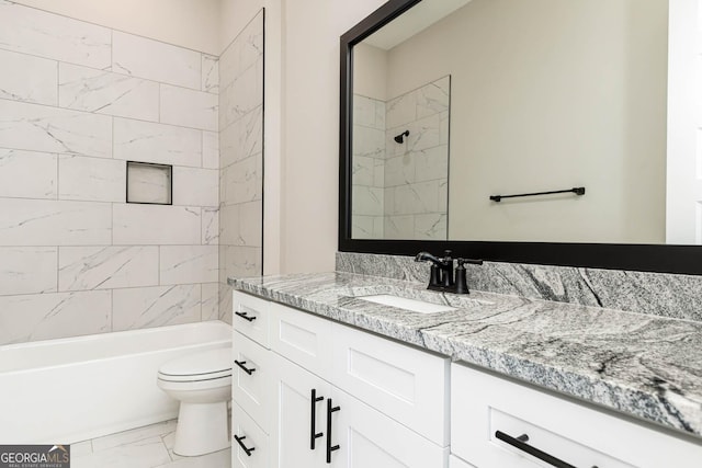 full bathroom with toilet, marble finish floor, shower / washtub combination, and vanity