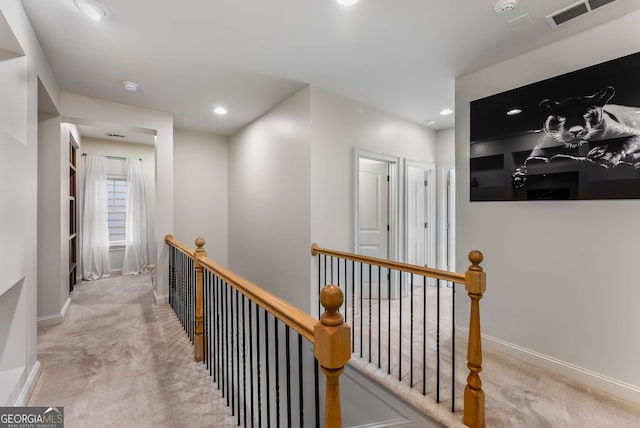 hall featuring carpet floors, recessed lighting, an upstairs landing, and visible vents
