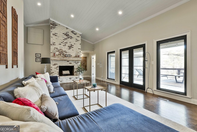 living area featuring wood finished floors, wood ceiling, visible vents, french doors, and crown molding