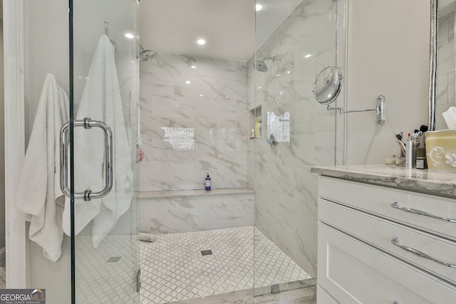 full bath featuring a stall shower and vanity