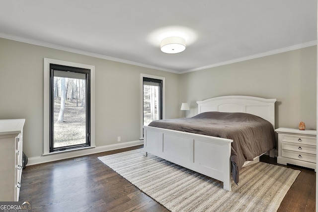 bedroom featuring dark wood-style floors, crown molding, visible vents, and baseboards