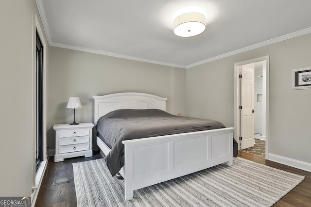 bedroom featuring ornamental molding, dark wood finished floors, and baseboards