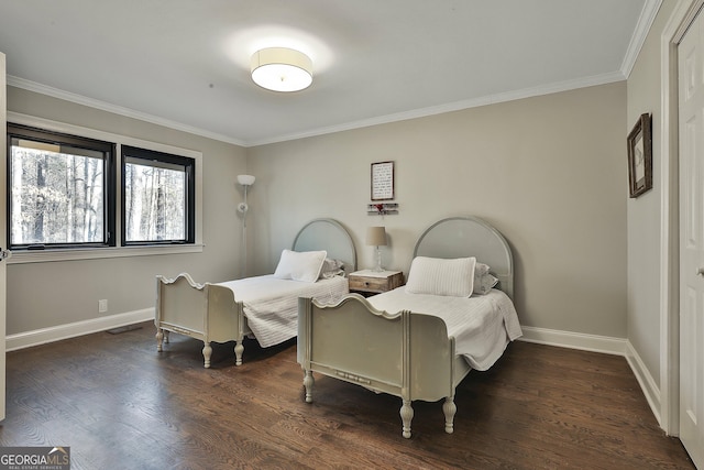 bedroom with visible vents, baseboards, dark wood finished floors, and crown molding