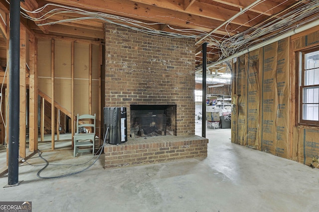 below grade area featuring a brick fireplace