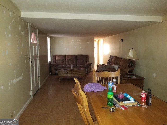 dining space with wood finished floors