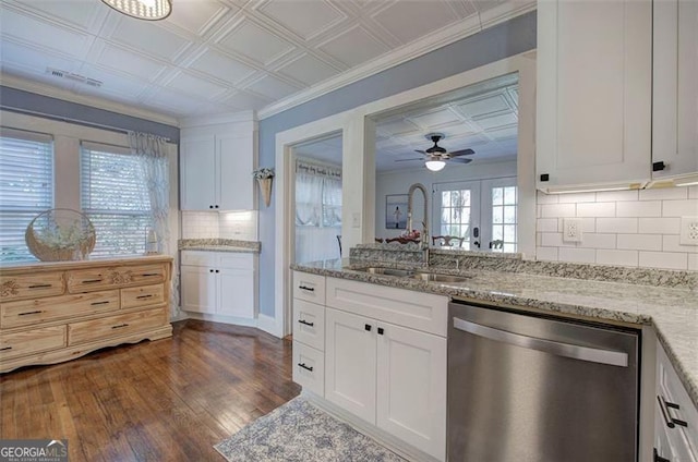 kitchen with dishwasher, dark wood-style floors, an ornate ceiling, white cabinetry, and a sink