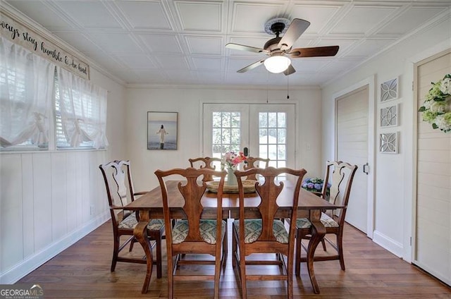 dining area featuring an ornate ceiling, french doors, dark wood-type flooring, a ceiling fan, and baseboards