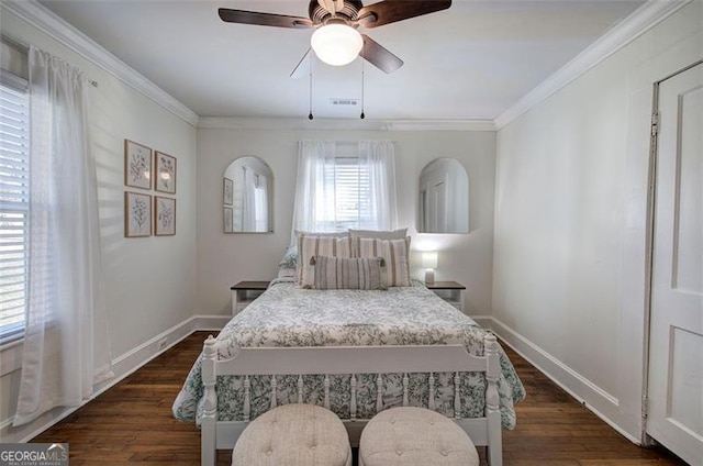 bedroom featuring dark wood-style flooring, crown molding, visible vents, a ceiling fan, and baseboards