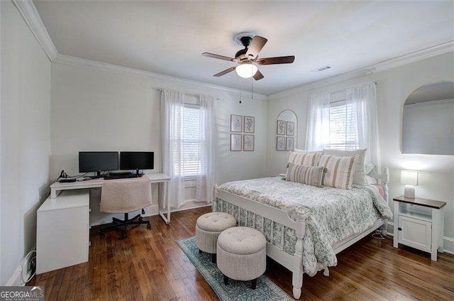 bedroom featuring ornamental molding, dark wood-style flooring, visible vents, and baseboards