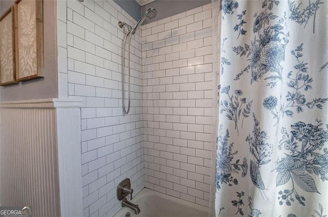 full bathroom with shower / tub combo with curtain and wainscoting