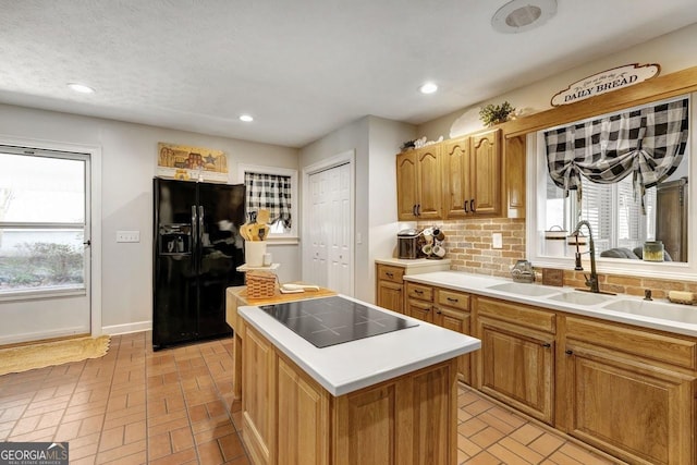 kitchen featuring black appliances, backsplash, and recessed lighting