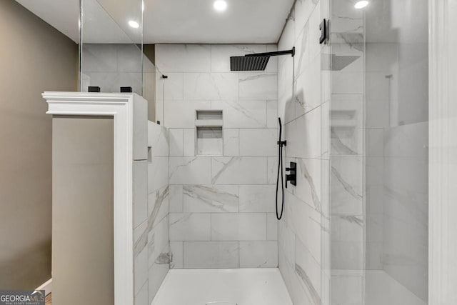 full bathroom with recessed lighting and a tile shower